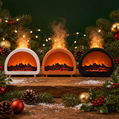 Three small arched tabletop fireplace decor units with faux flames and logs, arranged on a wooden surface with pine branches, ornaments, and string lights around them.